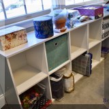 F40. 2 Sets of white cubby shelves. 